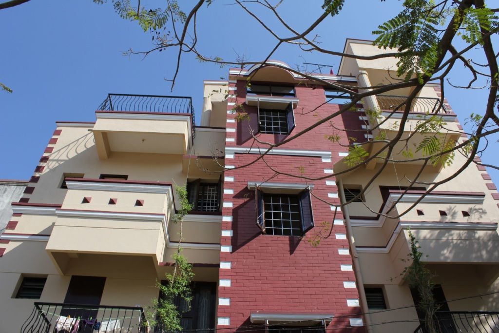 Hostel building with balconies, seen from the street